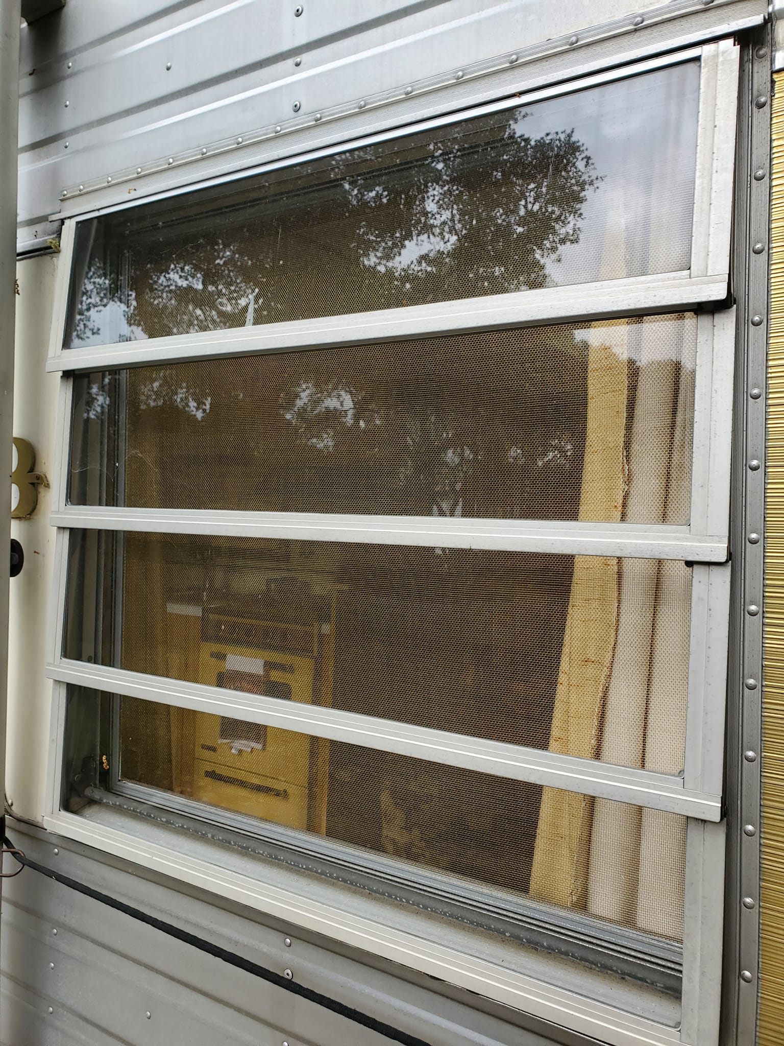 RV sliding window screen replacement — exterior view